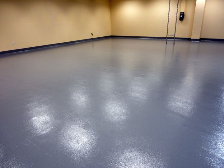 Glossy blue epoxy floor in a commercial kitchen