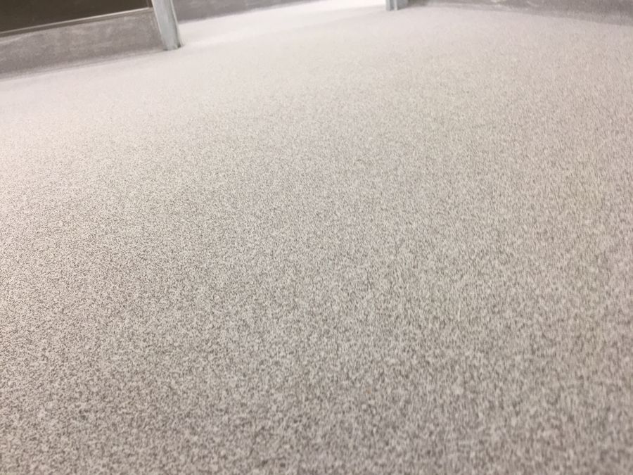 Speckled seamless restroom floor coating